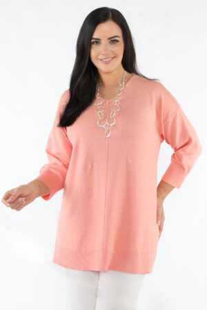 Model is wearing soft raglan jumper in coral by Ciso for Froxx Clothing plus sizes